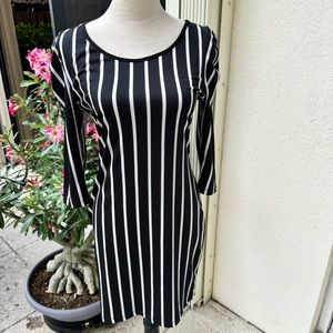 TOUCH ME. Body Con, Vertical Striped dress. Ruched Sleeves. 3/4 sleeves.…